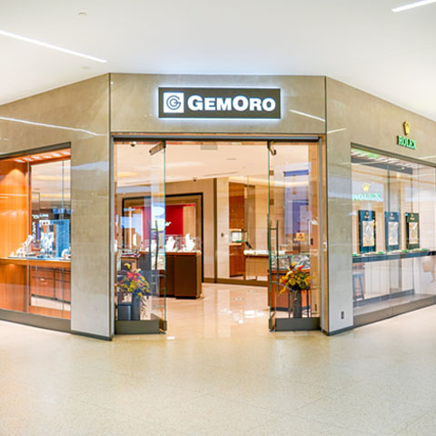 A storefront with a welcoming open door and Gemoro's logo mounted at the top.